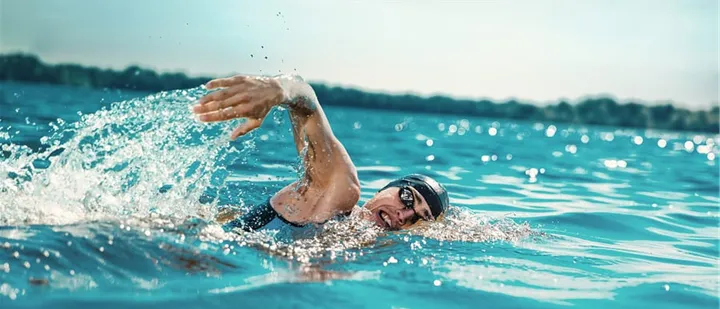 Single person swimming in a lake